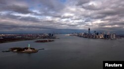 FILE - An aereal view of the Statue of Liberty, Liberty Island and Ellis Islands (L), next to New York's Lower Manhattan skyline, New York. 