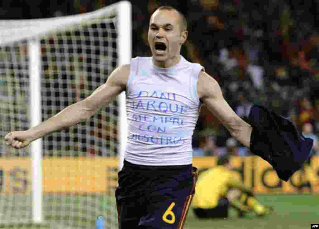 Spain's Andres Iniesta celebrates after scoring a goal, with the words "Dani Jarque, always with us", written on his undershirt, during the World Cup final soccer match between the Netherlands and Spain at Soccer City in Johannesburg, South Africa, Sunday