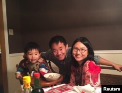 FILE - Xiyue Wang, a naturalized American citizen from China, arrested in Iran last August while researching Persian history for his doctoral thesis at Princeton University, is shown with his wife and son in this family photo released in Princeton, N.J., July 18, 2017.