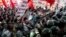 Chinese demonstrators clash with policemen during an anti-Japan protest outside the Japanese Embassy in Beijing, China, September 15, 2012. 