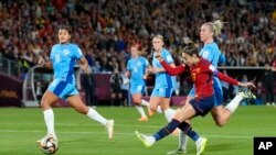 FILE - Spain's Olga Carmona scores her side's opening goal during the Women's World Cup soccer final between Spain and England at Stadium Australia in Sydney, Australia, Sunday, Aug. 20, 2023.
