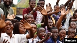 People react as Pope Francis arrives to start his apostolic journey, in Kinshasa, Democratic Republic of Congo, January 31, 2023. (REUTERS/Yara Nardi)