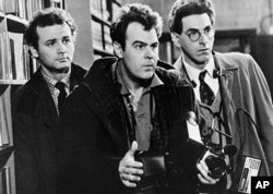FILE - In an undated file photo, Bill Murray, Dan Aykroyd, center, and Harold Ramis, right, appear in a scene from the 1984 movie "Ghostbusters".