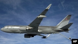 The Boeing NewGen tanker flies with boom extended, ready to refuel a receiver aircraft