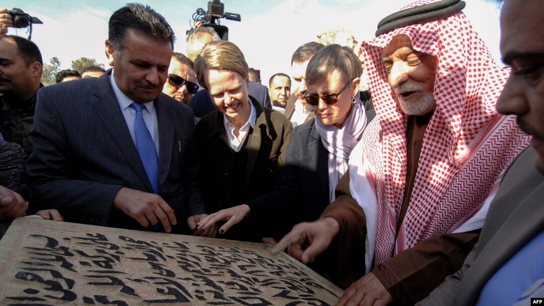 Abdullatif Al-Humaym, the head of Sunni Muslim endowments in all of Iraq, 2nd right, places the cornerstone for the rebuilding of the Great Mosque of Al-Nuri in Mosul’s war-ravaged Old City, Dec. 16, 2018. 
