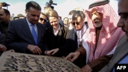 Abdullatif Al-Humaym, the head of Sunni Muslim endowments in all of Iraq, 2nd right, places the cornerstone for the rebuilding of the Great Mosque of Al-Nuri in Mosul’s war-ravaged Old City, Dec. 16, 2018. 