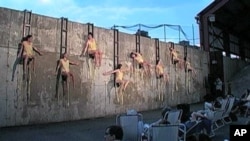 In 'Melt' dancers seem pinned to a concrete wall and appear to drip mellting beeswax