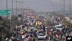 Farmers participate in a protest march towards the capital during India's Republic Day celebrations in New Delhi, India, Jan. 26, 2021. 