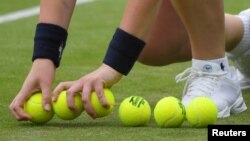 FILE - A ball boy with new tennis balls during a Wimbledon match on July 4, 2017. (REUTERS/Toby Melville)