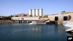 FILE - This photo shows a general view of the dam in Mosul, 360 kilometers (225 miles) northwest of Baghdad, Iraq.