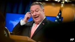 Secretary of State Mike Pompeo speaks to reporters at a news conference at the State Department in Washington, Oct. 23, 2018.