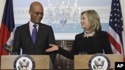 U.S. Secretary of State Hillary Rodham Clinton and Haiti's President-elect Michel Martelly take part in a joint news conference at the State Department, April 20, 2011