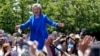 Hillary Clinton greets supporters upon her arrival for a speech at Roosevelt Island in New York at the first major rally of her 2016 campaign for the presidency, June 13, 2015.