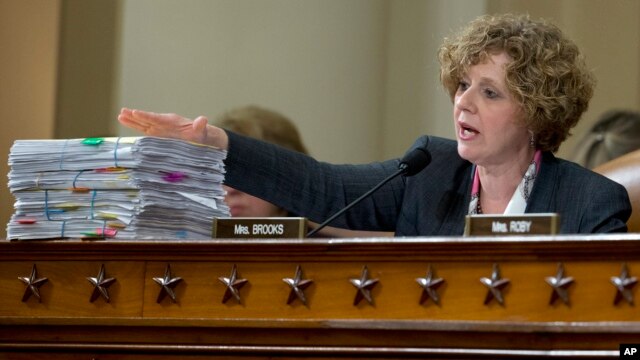 U.S. Rep. Susan Brooks, R-Ind., at a House hearing on the attacks on the U.S. consulate in Benghazi in 2012, presents copies of a collection of emails that she said suggested that the Obama administration and former Secretary of State Hillary Clinton lost