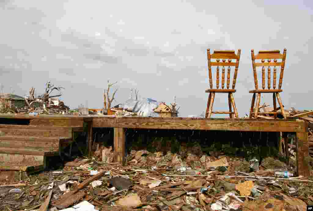 June 1: Two kitchen chairs are all that is left in a destroyed house following the May 22 tornado in Joplin, Missouri. (REUTERS/Sarah Conard)