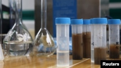 Samples taken from an area near last week's explosions are seen on a table at a monitoring station to check for environmental pollution in Tianjin, China, August 18, 2015.