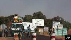 A public transport minibus is stopped by Malian soldiers at a checkpoint at the entrance to Markala, approximately 40 km outside Segou on the road to Diabaly, in central Mali, Jan. 14, 2013.