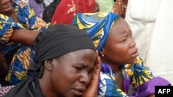 Mothers of the missing Chibok school girls abducted by Boko Haram Islamists gather to receive informations from officials, May 5, 2014.