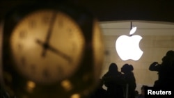The Apple logo is pictured behind the clock at Grand Central Terminal in the Manhattan borough of New York, Feb. 21, 2016. 