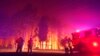 FILE - Firefighters battle a wildfire at Wooroloo, near Perth, Australia, Feb. 1, 2021. 