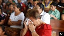 FILE - Samoans attend church services at Holy Cross Catholic Church in Leone, American Samoa, Oct. 4, 2009. Many women in Samoa have experienced violence, according to a 2007 study.