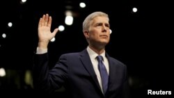 FILE - U.S. Supreme Court nominee judge Neil Gorsuch is sworn in to testify at his Senate Judiciary Committee confirmation hearing on Capitol Hill in Washington, March 20, 2017. 