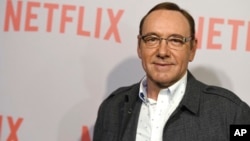 FILE - Kevin Spacey arrives at the Samuel Goldwyn Theater in Beverly Hills, Calif., April 27, 2015. Netflix says Spacey is out at "House of Cards" after a series of allegations of sexual harassment and assault and it is cutting all ties with Spacey.