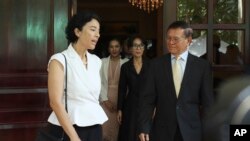 FILE PHOTO - Cambodia National Rescue Party's President Kem Sokha, right, talks with French Ambassador to Cambodia Eva Nguyen Binh, left, at his house in Phnom Penh, Cambodia, Monday, Nov. 11, 2019.