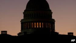 FILE - The U.S. Capitol Building Dome is seen before the sun rises in Washington, Dec. 18, 2018. 