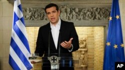 In this photo released by Greek Prime Minister's office, Greek Prime Minister Alexis Tsipras speaks during a televised address to the nation, in Athens, June 12, 2018. 