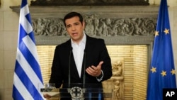 In this photo released by Greek Prime Minister's office, Greek Prime Minister Alexis Tsipras speaks during a televised address to the nation, in Athens, June 12, 2018.