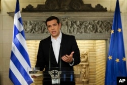 In this photo released by Greek Prime Minister's office, Greek Prime Minister Alexis Tsipras speaks during a televised address to the nation, in Athens, June 12, 2018.