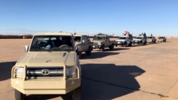 FILE - Military vehicles are seen near Al-Tanf, Syria, Jan. 18, 2021, near the border with Iraq and Jordan. 