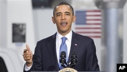President Barack Obama gestures while speaking at a UPS facility in Landover, Maryland, April 1, 2011