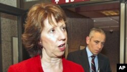 EU foreign policy chief Catherine Ashton addresses the media prior to the start of an EU foreign ministers meeting at the European Council building in Brussels, December 1, 2011