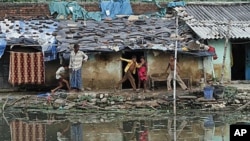Children play at a slum in Allahabad, India, Oct. 3, 2011.