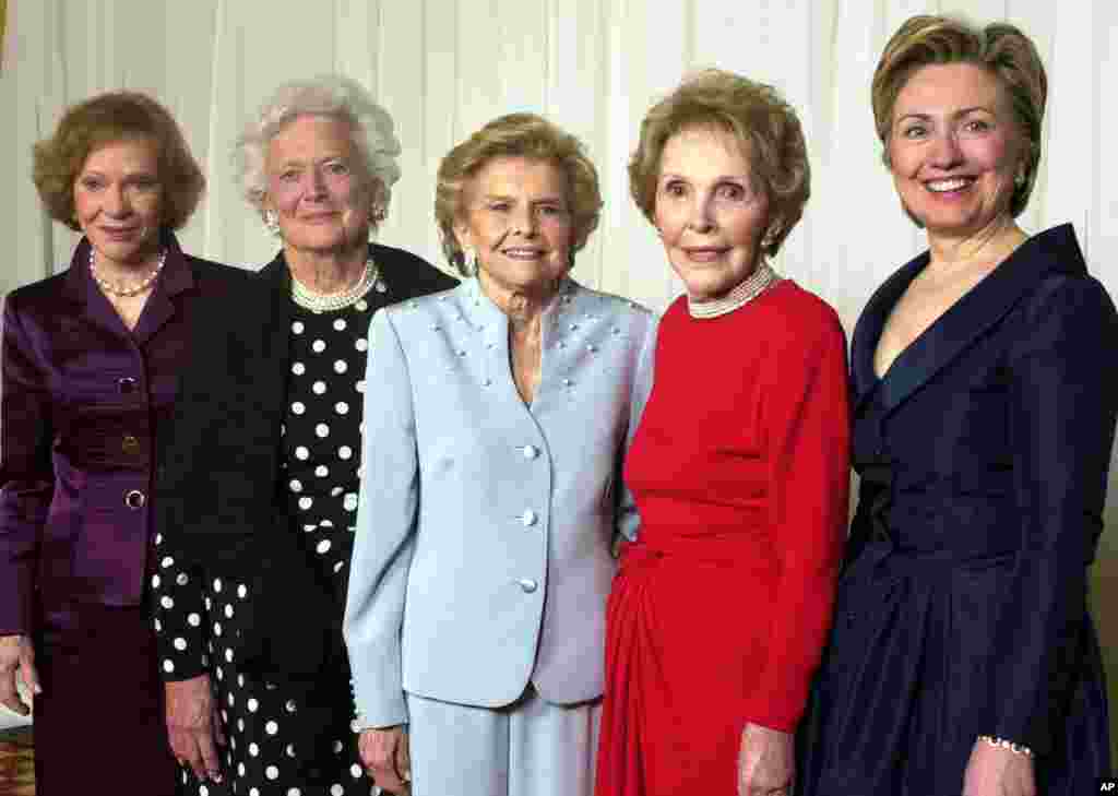 FILE - In this Jan. 17, 2003 file photo, former first ladies get together for a group photo at a gala 20th anniversary fundraising event saluting Betty Ford and the Betty Ford Center in Indian Wells, Calif. 