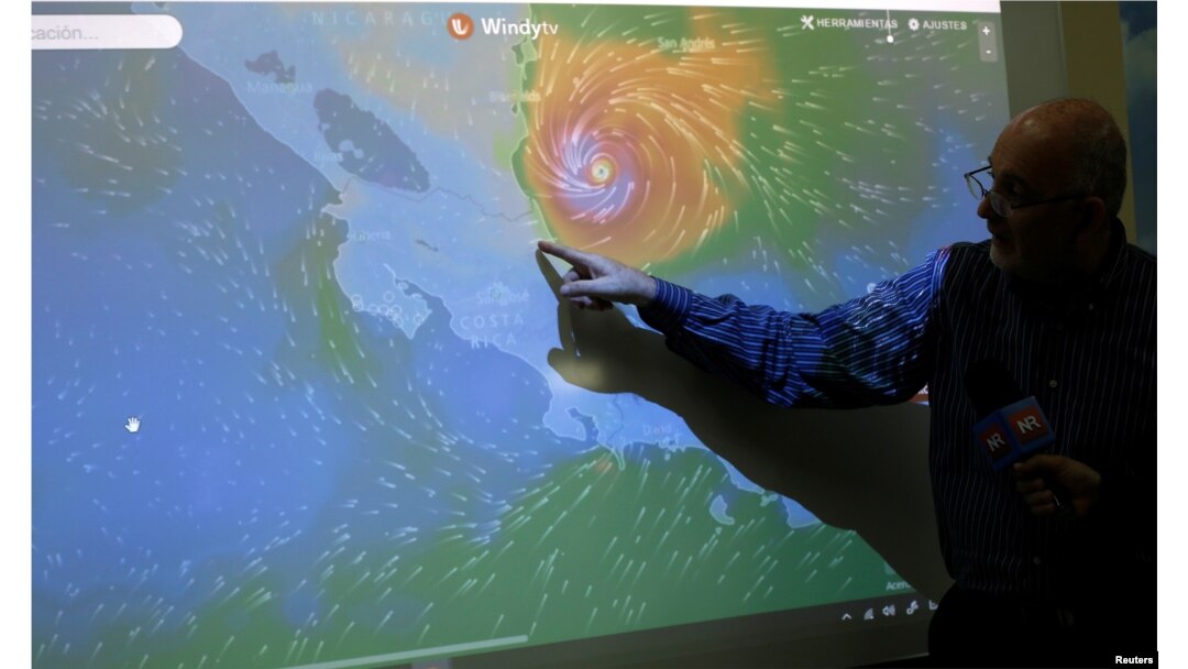 An official of the National Institute of Meteorology shows on a screen the advance of the Hurricane Otto in San Jose, Costa Rica, Nov. 24, 2016.