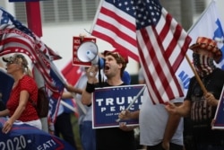 Supporters of U.S. President Donald Trump gather outside Perez Art Museum before his arrival for a town hall in Miami, Florida, U.S., October 15, 2020. REUTERS/Marco Bello