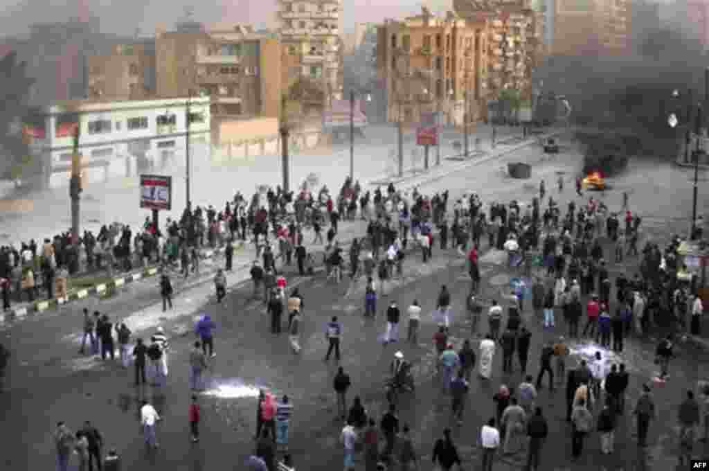 Egyptians protestors uring clashes with anti-riot policemen in Suez, Egypt, Thursday, Jan. 27, 2011. Egyptian activists protested for a third day as social networking sites called for a mass rally in the capital Cairo after Friday prayers, keeping up the 