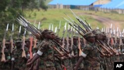 Somali government soldiers trained by the European Union Training Mission team march during their passing out ceremony at Bihanga army training camp, 368 km (230 miles) west of Kampala, February 1, 2013. 