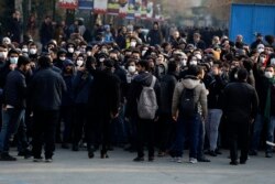 FILE - Anti-government protesters attend a demonstration blaming the government for the delayed announcement of the unintentional downing of a Ukrainian plane last week, at the Tehran University campus in Tehran, Iran, Jan. 14, 2020.