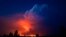 In this photo provided by the Oregon Office of State Fire Marshall, flames and smoke rise from the Bootleg Fire in southern Oregon on July 14, 2021.