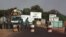 A public transport minibus is stopped by Malian soldiers at a checkpoint at the entrance to Markala, approximately 40 km outside Segou on the road to Diabaly, in central Mali, Jan. 14, 2013.