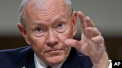 FILE - Chairman of the Joint Chiefs of Staff General Martin Dempsey testifies during a Senate Armed Services Committee hearing on "Counter-ISIL Strategy" on Capitol Hill in Washington, July 7, 2015.