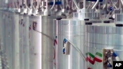 In this image made from April 17, 2021, video released by Islamic Republic Iran Broadcasting, various centrifuge machines line the hall at the Natanz Uranium Enrichment Facility, April 11, 2021.