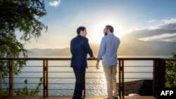 Handout picture released by El Salvador's Presidency press office showing US Secretary of State Marco Rubio, left, meeting with El Salvador's President Nayib Bukele at his residence in Lake Coatepeque, El Congo municipality, El Salvador, on Feb. 3, 2025.