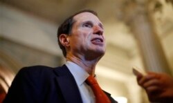 FILE - Sen. Ron Wyden speaks to reporters after leaving the Senate on Capitol Hill in Washington, D.C., in April 2011.