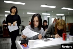 FILE - Japanese Yuuka Hasumi, 17, and Yuho Wakamatsu, 15, attend a Korean language class in Seoul, South Korea, March 12, 2019. (REUTERS/Kim Hong-Ji/File Photo)
