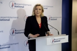 French far-right Rassemblement National (RN) party's leader Marine Le Pen speaks to the press at the party's headquarters after the first results in the second round of French regional elections, in Nanterre, June 27, 2021.